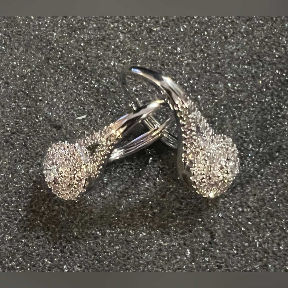 Beautiful clustered zirconia stones laid in a silver tone locking back earring.